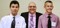 Teacher of the Year Charles Giglio (center) with two of his Gloversville High School Latin students. Photo by El-Wise Noisette.