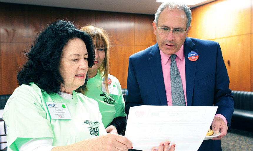 School nurses and members of the Syracuse TA, Ann O’Hara, left, and Nancy Liszewski, meet with NYSUT Executive Vice President Andy Pallotta. Photo by El-Wise Noisette.