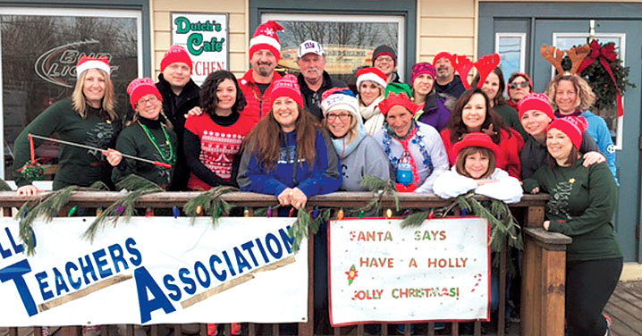 Members of the Monticello Teachers Association, with NYSUT Secretary-Treasurer Martin Messner, third from left, prepare for the union's second annual Tinsel Trot 5K. The event drew more than 200 participants — and raised more than $12,500 to benefit the MTA Scholarship Fund and the Sullivan County Federation for the Homeless. MTA President John Maranzana said the event owes its success to many members, including Sheryl Manz, Tim and Allie Billias and Gary Silverman.