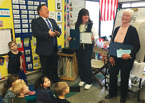 Albany County Executive Dan McCoy presents Judy Tambasco, center, retired teacher, and Roz Moser, retired school nurse; with Citizens of the Month certificates to honor their volunteer work. For 20 years, Tambasco and Moser have volunteered to run the 1,000 Book Child reading program for young students at Berne-Knox- Westerlo school district. The pair started the program to encourage youngsters to read, and each week participating students are given a bag of 10 books to take home.