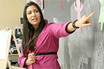 teacher at chalkboard