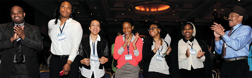 Educators, parents and students from the Young Women's Leadership School of Brooklyn are saluted at the RA. The students' video on human rights defender Juliana Dogbadzi won the Speak Truth to Power video contest. Photo by Michael Campbell.