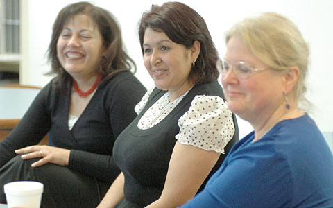 Maria Flores, community school coordinator; parent Patricia Bautista; and Port Chester Teachers Assocation President Linda O'Connor discuss the school’s strategies for improvement. Photo by Maria R. Bastone.