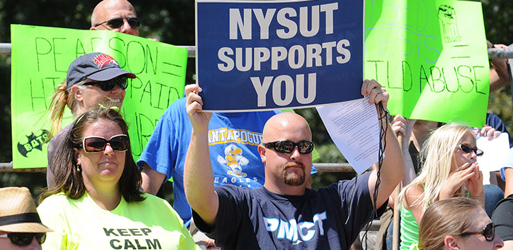 'nysut supports you' sign at rally