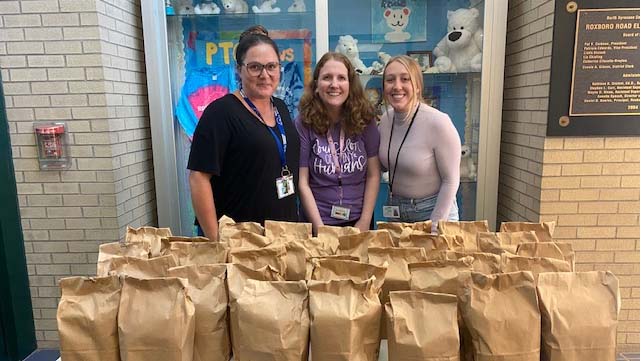 Making a delivery to Roxboro Elementary School, from left: Syracuse TA members Jessica Nabewaniec, Kerry Delduchetto, and Rachel Prikazsky.