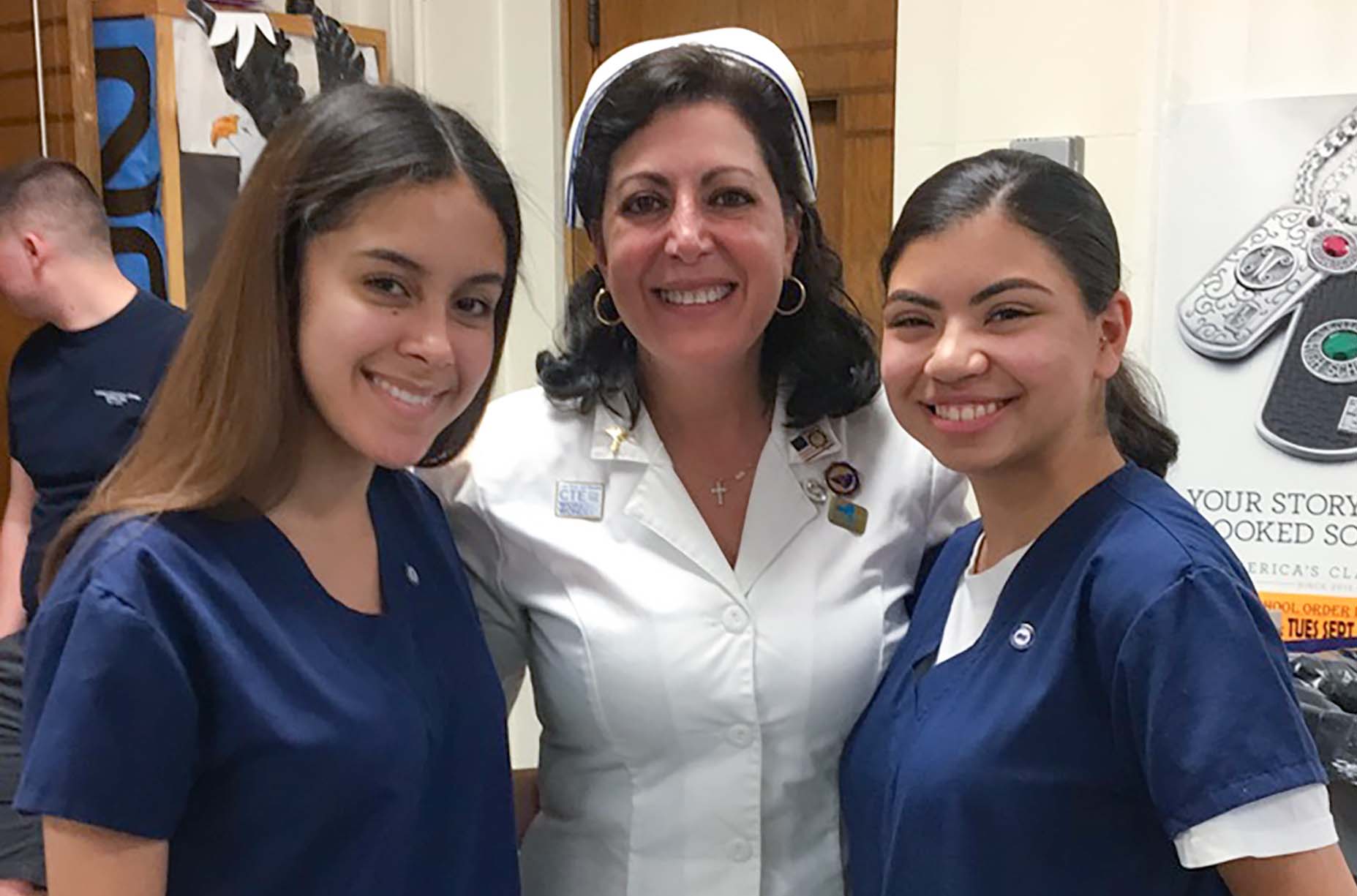 Linda Romano, member of the Newburgh TA and President of the New York State Association of Career and Technical Education, with two of her students from her Certified Nursing Assistant program at the Newburgh Free Academy. 