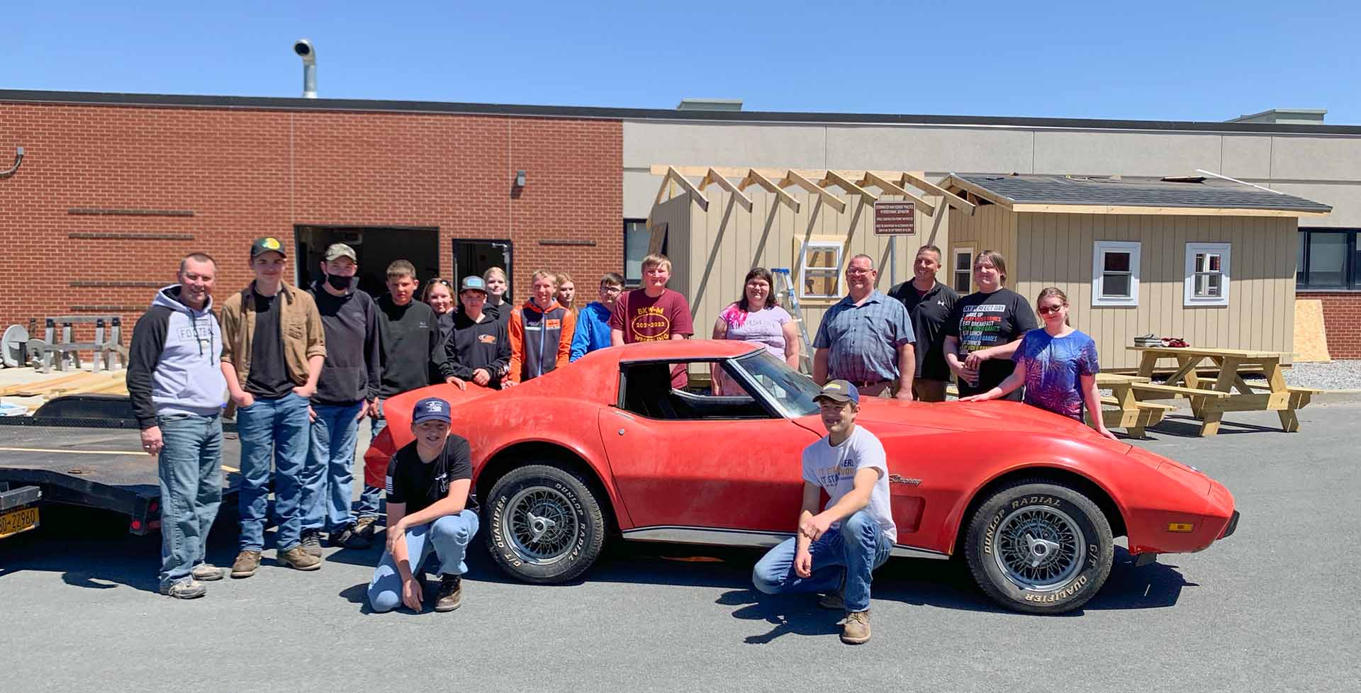 Berne-Knox-Westerlo CTE Teachers Josh Baker (fourth from right) and Bill Dergosits (third from right) with their students. The class is using their training to restore the 1976 Corvette Stringray, which will be auctioned off to raise funds for the district’s growing CTE program.