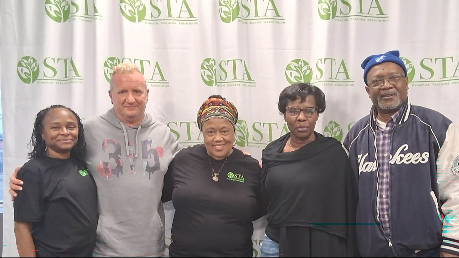 Syracuse Teachers Association ELT  Lead Teaching Assistants: (from left) Zarieff Brooks, Robert Skibinski, Lead Teaching Assistant Coach Cynthia Pace and ELT Lead Teaching Assistant Ava Darisaw, with Syracuse Teachers Association 4th Vice President and Unit 7 President Bernard Washington.