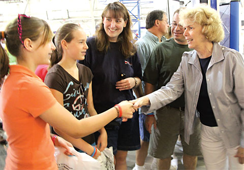 NYSUT Vice President Kathleen Donahue greets the Kio fam&not;ily at NYSUT's booth at the New York State Fair. Photo by Andrew Watson.