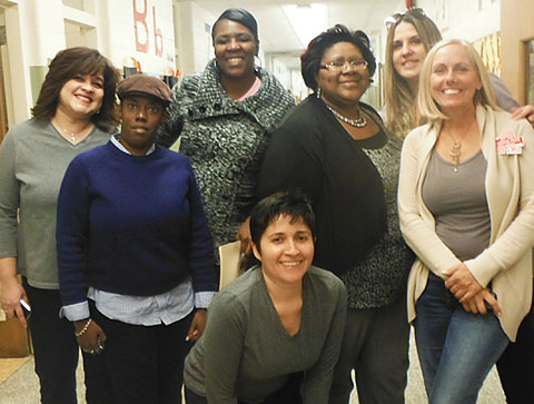 From left, Ivelise Olivera, a member of the Amityville Committee of Educational Secretaries; school monitors Erica Brown and Kim Hargwood; Amityville TA member Lissa Varas; Northeast Elementary School Principal Pauline Collins; volunteer Amanda Hawthorne; and ATA member Colleen Kretz all pitched in to help organize the family warming center.