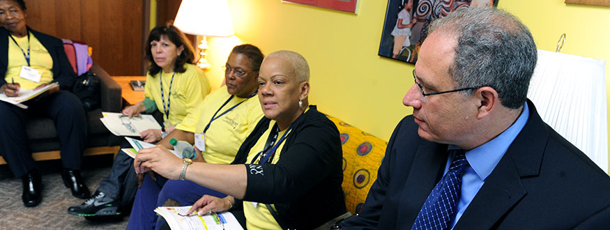 NYSUT Executive VP Andy Pallotta, right, listens as nurse Cora Shillingford, UFT, makes a point.
