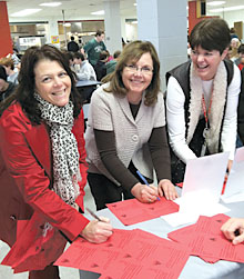 From left, Roberta Bittel, Student Government advisor; Canandaigua TA President Cheryl Birx; and special education teacher Barb Morgan sign valentines for lawmakers.