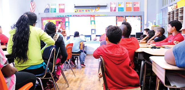 Krystal Pashley's fifth-grade class at Pleasant Valley Elementary School in the Schenectady City School District has ballooned to 29 from 22 students because of budget cuts. Photo by El-Wise Noisette. 
