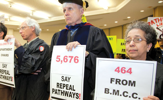 PSC members, from left, David H. Lieberman, Anthony Gronowicz and Joyce Moorman deliver to the CUNY Board of Trustees petitions with 5,676 signatures calling for the repeal of Pathways.
