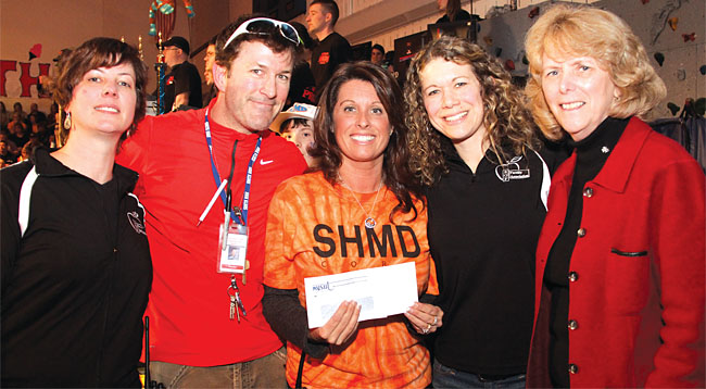 NYSUT Vice President Kathleen Donahue, right, joins members of the South Glens Falls Faculty Association, from left, Shannon Fagle-Fedele, Tom Myott, Jody Sheldon and Sarah Young in presenting a donation to the 37th annual South High Marathon Dance fundraiser in South Glens Falls.