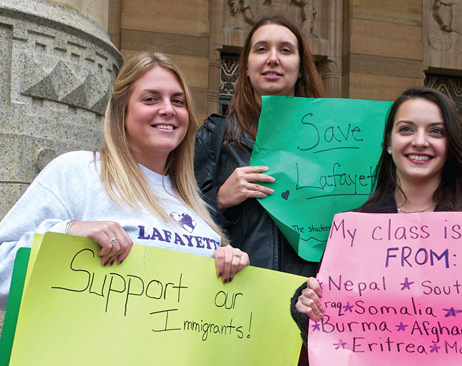 Melissa Sullivan, Jessica Gilmartin and Caitlin Pilliod, all teachers from Lafayette High School, join teachers, students and parents at a City Hall rally to support public schools.
