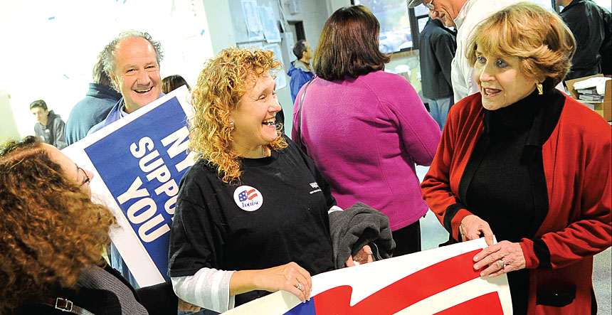 Ellen Mancuso, retired member  of the Monroe County Community College Faculty Association, center, is greeted  by Rep. Louise Slaughter at a rally at the Monroe County Democratic office  building. Photo by Steve Jacobs.