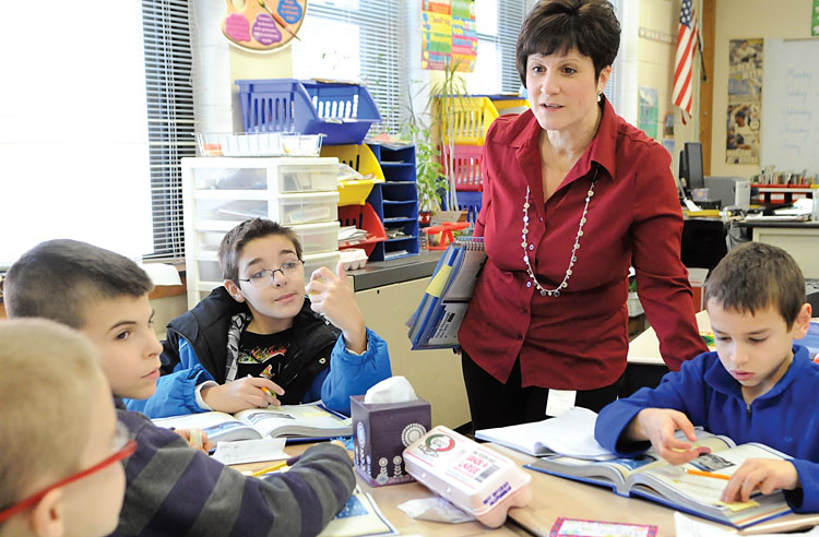 Levittown teacher Donna DiPalo, shown with her fourth-grade students, found the writing activities in the commercial Common Core program inadequate. Photo by Jonathan Fickies.