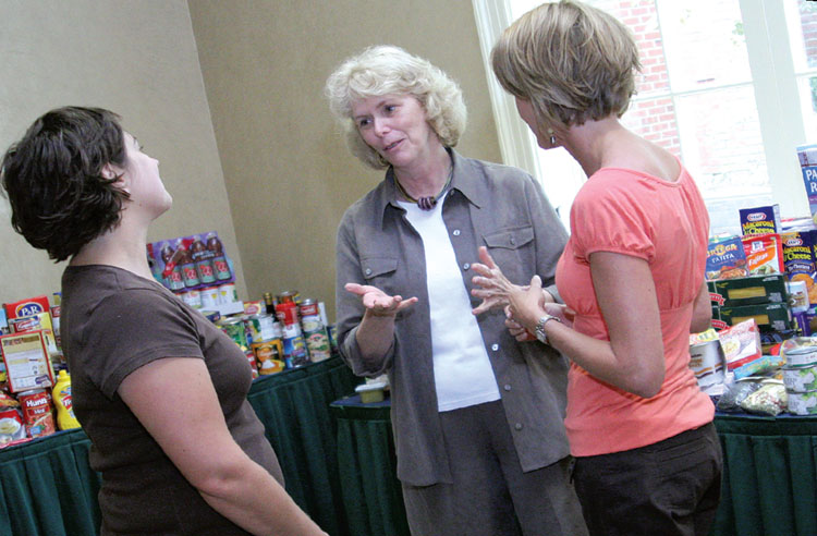 NYSUT Vice President Kathleen Donahue, center, chats with Jaime Williams, left, and Kari Cushing from the Franklin Community Center food pantry in Saratoga Springs. Locals participating in NYSUT’s Local Action Project annually donate hundreds of pounds of food to the center. Photo by Andrew Watson.