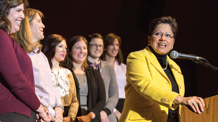 NYSUT Vice President Maria Neira congratulates the new NBCTs at the press event at Arlington High School.