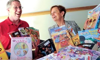 NYSUT Vice President Catalina Fortino and Olean TA President David Lasky with a collection of books.