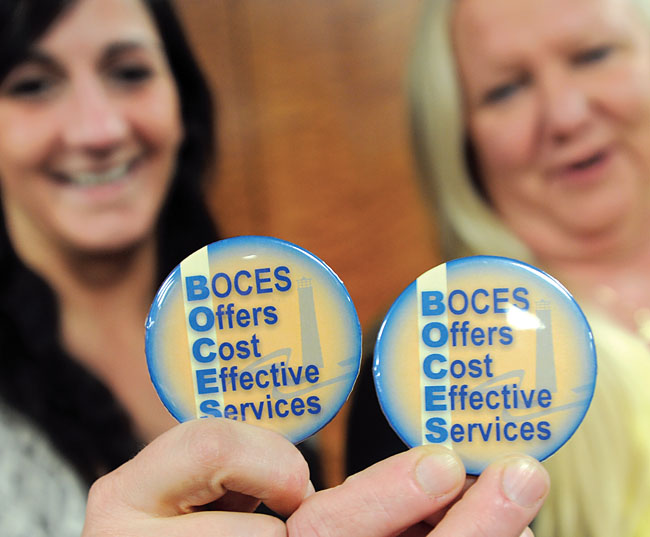 Their buttons say it all: Western Suffolk BOCES physical therapist Mary Brooks, right, president of the Alliance of School Based Health Professionals, joins fellow PT and ASBHP member Kristin Carney at the Capitol to advocate for adequate funding.