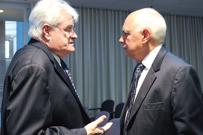 NYSUT President Dick Iannuzzi, right, talks with Regent Jim Tallon, who represents the Binghamton area, during a break at a recent Board of Regents meeting. 