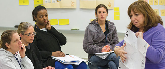 Lorraine Poccia, a trainer for the Hudson River Teacher Center, leads an early literacy skills session for Oakside Elementary teachers. Photo by Phillip Kamrass.