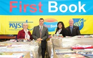 Ruth Shippee, president of Saratoga Adirondack BOCES EA; James Dexter, superintendent of WSWHE BOCES; NYSUT Board member Sandy Carner-Shafran of the SABEA; and WSWHE BOCES Principal Shawn Hunzicker mark the arrival of first books. Photo by El-Wise Noisette.