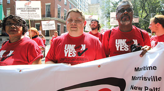 Downstate Medical Chapter President and UUP Treasurer Rowena Blackman-Stroud, NYSUT Secretary-Treasurer Martin Messner and UUP Vice President for Professionals J. Phillipe Abraham march in the annual Labor Day parade in Manhattan.
