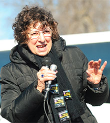 Jeanette Stapley, Champlain Valley Council of Retirees member, inspires riders on the "Call Out Cuomo" bus tour. The tour began in Plattsburgh and stopped at Massena and Watertown. Photo by Steve Jacobs.