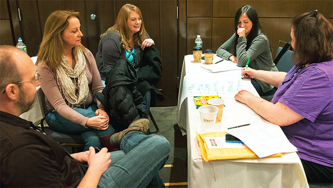 Educators at the NYSUT Health and Safety Conference brainstorm ways to relieve stress. From left: Colin Massulik, Maureen Flaherty, Kate O'Callaghan, Kristen Carney and Karen Stephens. Photo by Marty Kerins Jr.