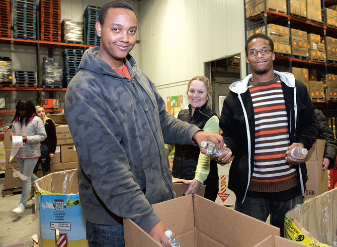 Bridge students and Berkshire TA Vice President Helen Thompson, center, help out at the Regional Food Bank of Northeastern New York.