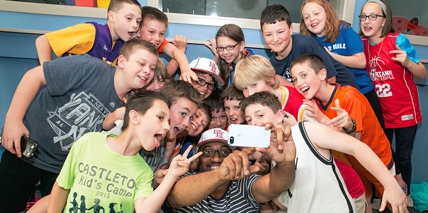 2015 Newbery Medal winner Kwame Alexander  takes selfies with fifth-graders at Castleton Elementary School. Photo by Marty  Kerins Jr.