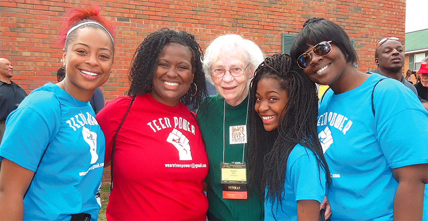 Susan Butler, center, with two families from Detroit who  attended the 50th anniversary of the 1965 march from Selma to Montgomery, Ala.