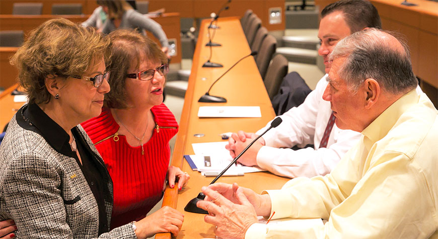Clockwise, from bottom left, NYSUT Vice President Catalina R. Fortino; Pat Puleo, president of the Yonkers Federation of Teachers; Nick Whitman, NYSUT labor relations specialist; and Phil Rumore, president of the Buffalo Teachers Federation, are part of the leadership team weighing receivership issues.
