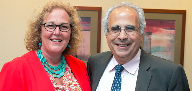 NYSUT President Karen E. Magee welcomes polling expert John Zogby to NYSUT headquarters for his talk about the Millennial Generation. NYSUT is a leading supporter of the United Way of the Capital Region, which sponsored the event. Zogby said millennials are shaped by the technology that is omnipresent in their lives and view themselves as global citizens. Photo by Marty Kerins Jr. 