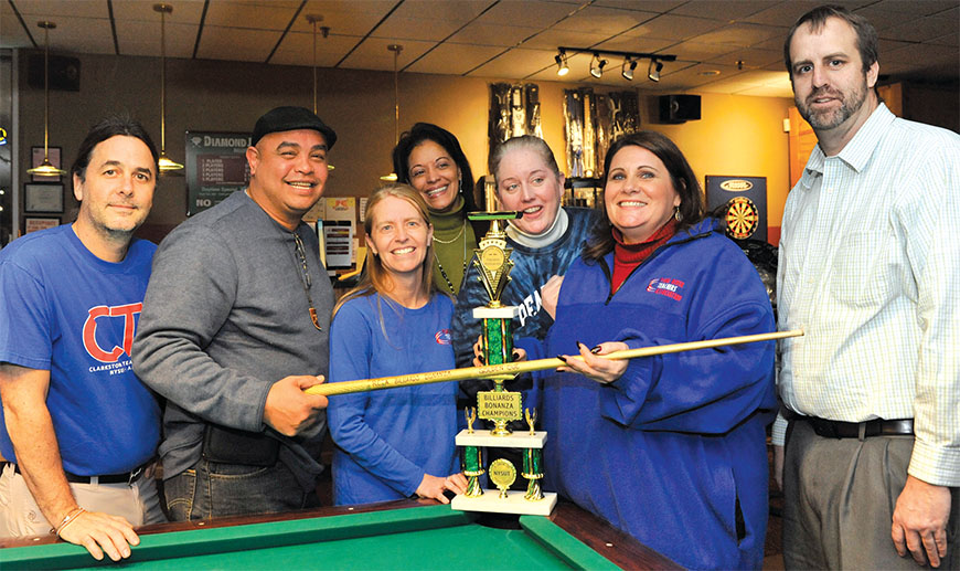 Event coordinators John Wedvik (far left), Clarkstown TA, and Kevin O’Connor (far right), Pearl River TA, congratulate, from left: Alvin Santiago, Kirsten Gorman, “cheerleader” Vivian Toledo, Marie Walmsley and Karen DiMenna, all of the Pearl River TA.