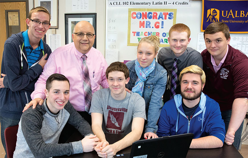 Some of Mr. G's students work on language presentations during study hall. Front row, from left: Justin Putnam, Sedrik Nellis and Riley Palmer. Back row: Tyler Unislawski, teacher Charlie Giglio, Emily Ross, Bradley Mulligan and Joshua Young. Photo by Marty Kerins Jr.