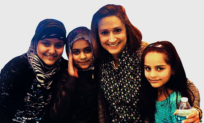 Betsey Domenico, third from left, a teacher at Giffen Elementary School in Albany, with some of her English language learners.