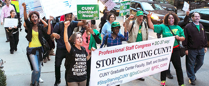 Activists march in midtown Manhattan to call on state lawmakers to fully fund CUNY.