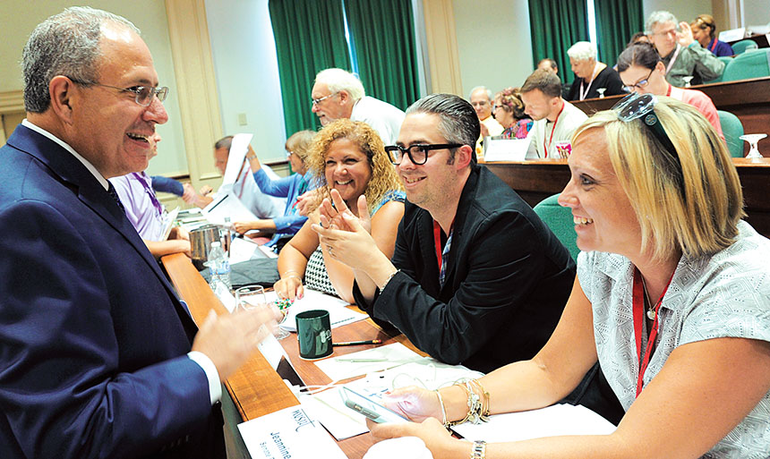 Executive Vice President Andy Pallotta discusses endorsements with, from left: PAC members Syndee Zegel, Patchogue Medford CT; Robert Ciani, Commack TA; and Jeannine Smith, Middle Country TA.
