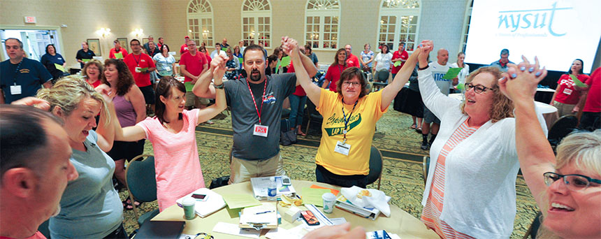 Members of the Copenhagen Teachers Association,a first-year LAP local, join NYSUT President Karen E.Magee, right, in a team-building moment during thesummer session of NYSUT's Local Action Project. Photo by El-Wise Noisette.