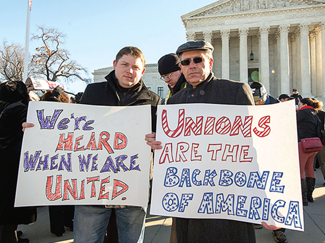NYSUT Secretary-Treasurer Martin Messner, left, and Executive Vice President Andy Pallotta take part in a rally on the steps of the U.S. Supreme Court as justices hear arguments in Friedrichs v. California Teachers Association. An adverse decision would have damaging effects on public sector unions. Photo by Michael Campbell.