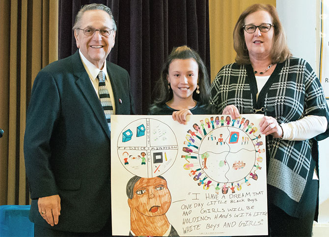NYSUT Executive Vice President Emeritus Alan B. Lubin and NYSUT President Karen E. Magee congratulate Janessa Jones, a Schenectady sixth-grader, for her first-place award in the Alan B. Lubin MLK Poster Contest. Evelyn Meddaugh, also a Schenectady sixth-grader, won second place.