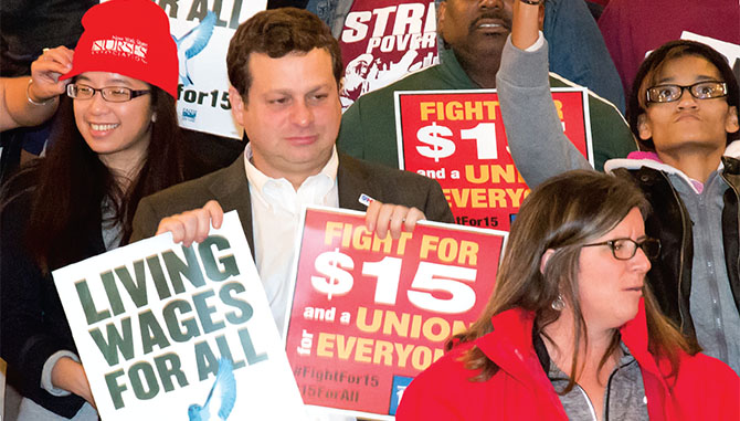 NYSUT Vice President Paul Pecorale joins activists at the Capitol to call on lawmakers to raise the minimum wage for all workers — a move that requires legislative action. Photo by Marty Kerins Jr. 