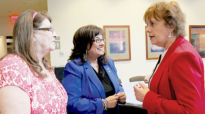 From left, Colleen Condolora, Capital Region BOCES TA, and Sandie Carner-Shafran, Saratoga Adirondack BOCES EA, discuss concerns with NYSUT Vice President Catalina Fortino.