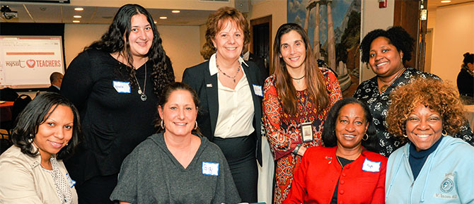 NYSUT Vice President Catalina Fortino and teachers from the Roosevelt Union Free School District celebrate newly designated National Board Certified Teachers at a NYSUT-sponsored event at Adelphi University.