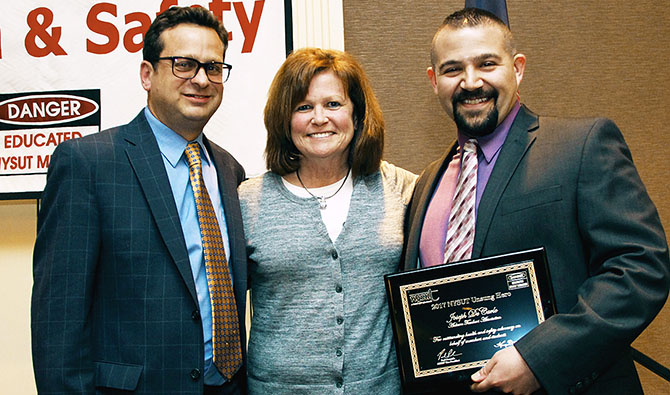 NYSUT Vice President Paul Pecorale and Auburn TA President Cheryl Miskell congratulate Auburn TA member Joe DeCarlo for being named the 2017 NYSUT Unsung Hero.