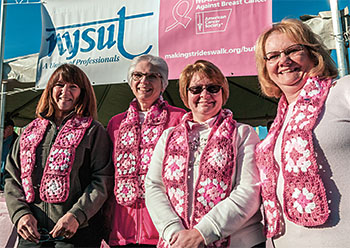 From left: Kathy Scalfani, Bonnie Krupper, Jackie Leggett and Donna Parent, all members of the Lewiston-Porter Administrative Professionals, model scarves made by Leggett.The women participated in the Buffalo Making Strides Against Breast Cancer walk in October. For more photos of walks around the state, visit www.nysut.org.